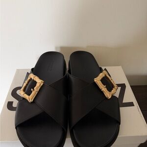 SCHUTZ Black Slide Sandals with Gold Buckle